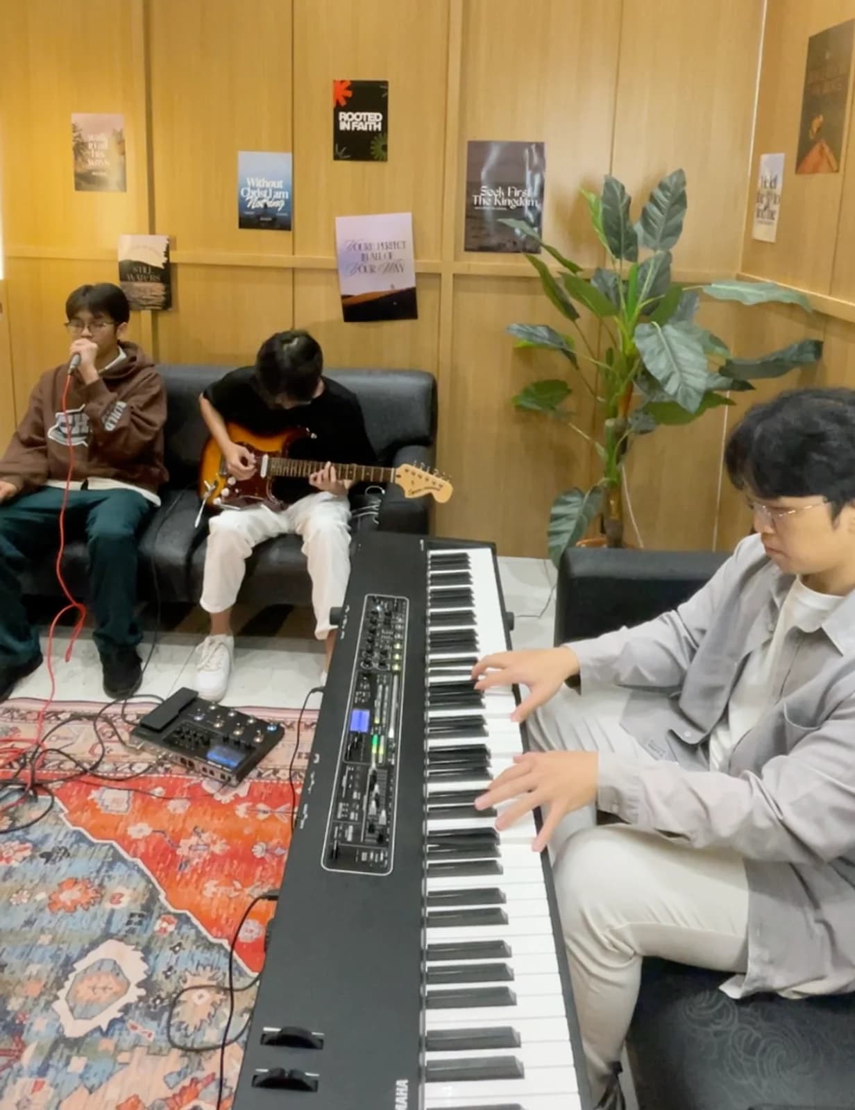 Keane tracking keyboard alongside a vocalist and guitarist