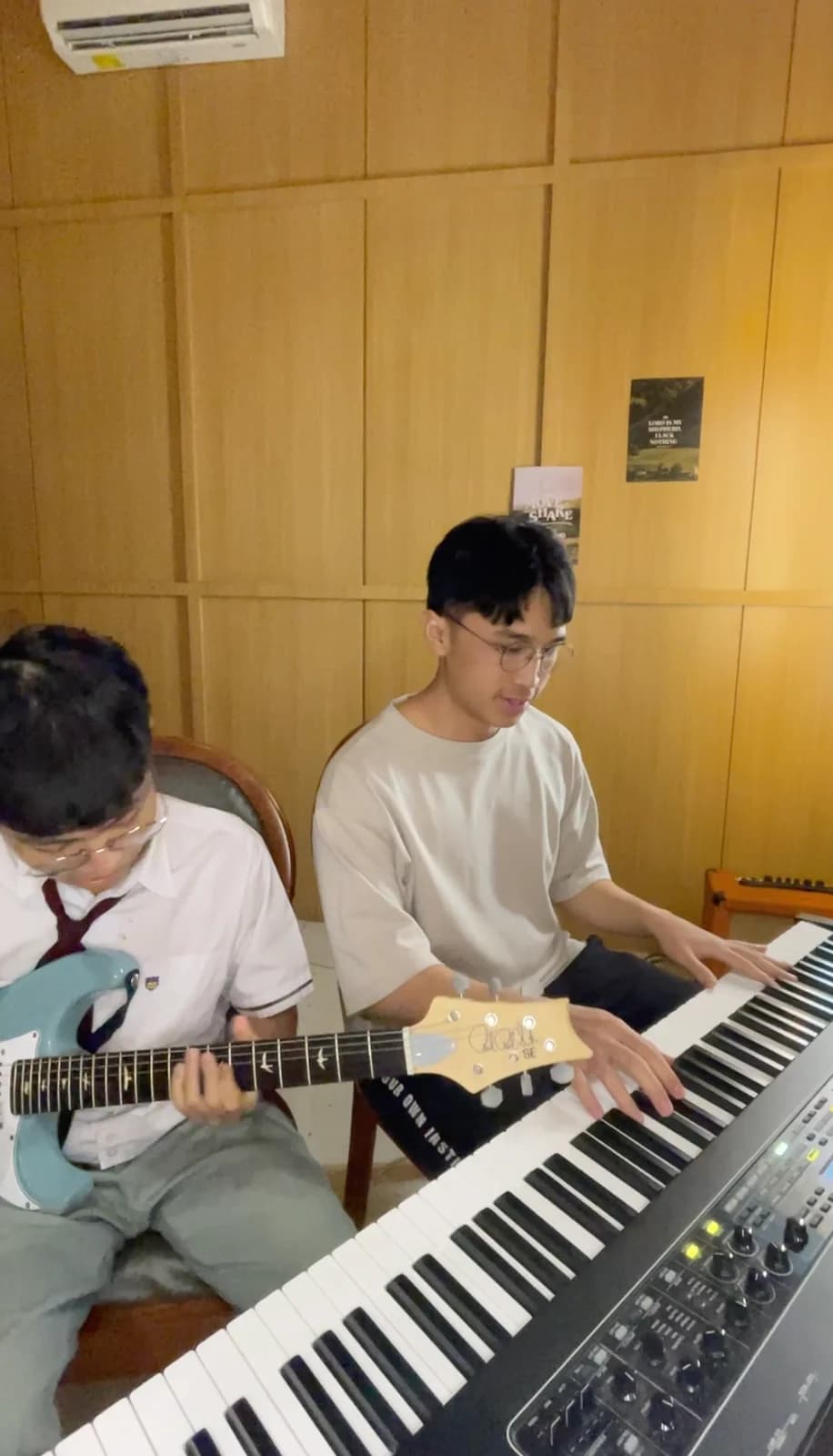 Keane collaborating on keys with an electric guitarist