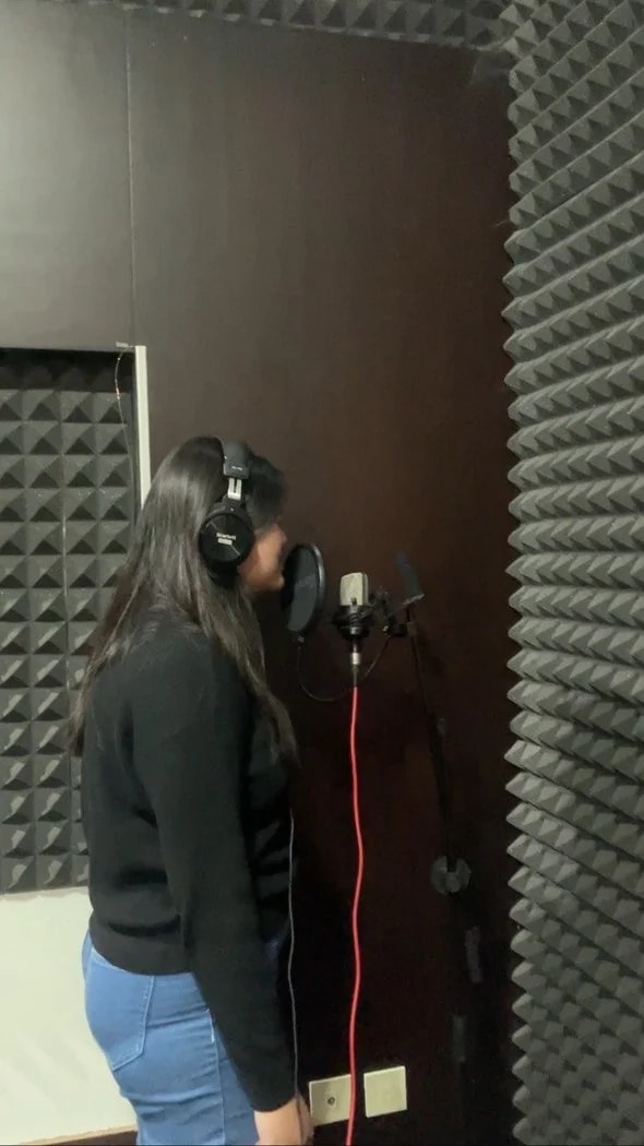 Vocalist recording at a studio microphone